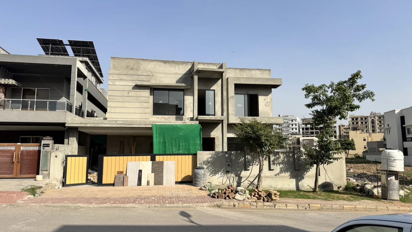 The same house at grey structure, May 2025 — RCC frame before finishing